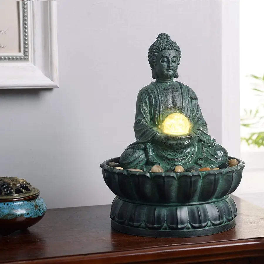 Sitting Buddha Fountain: a lighted vision of inner peace